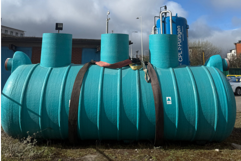 blue oil separator on the ground ready to be installed