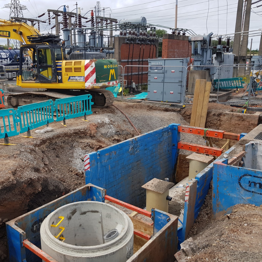 interceptor install project on an electricity substation with excavator in the background