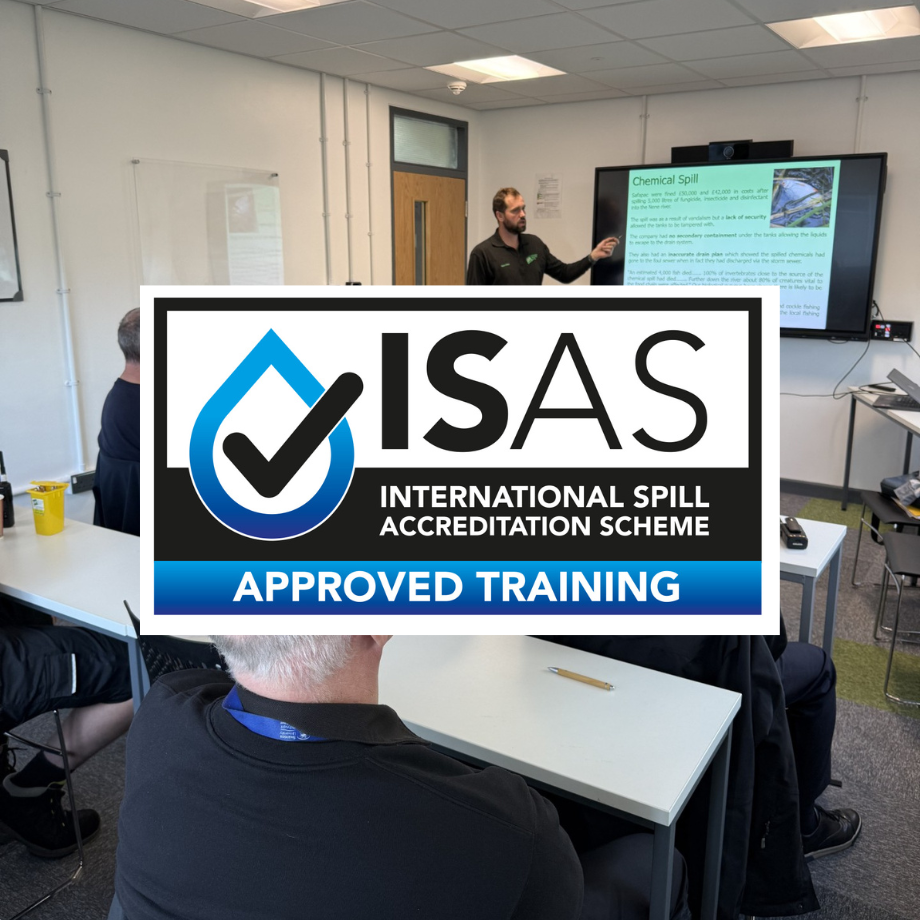 a classroom session with a trainer pointing at the tv with the ISAS logo overlaid on top